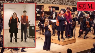 Ellerini orkestra şefinin kürsüsüne yapıştıran iklim aktivistlerini görevliler depoya kaldırdı