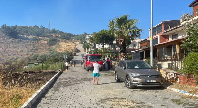 İzmir’de otomobilde çıkan yangın makilik alana sıçradı